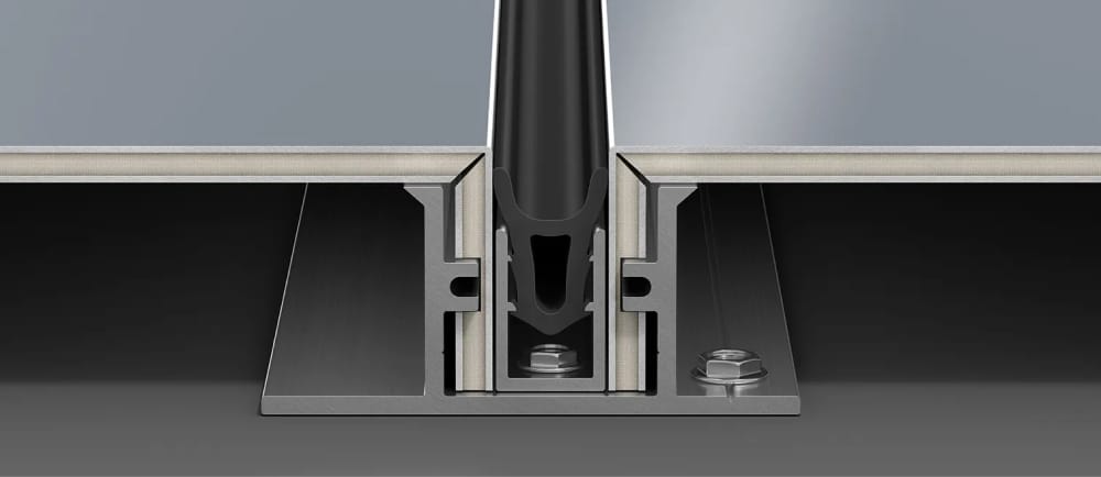 A close-up technical rendering of a metal panel assembly, showing interlocking sections with bolts and a rubber gasket in the middle. The sheet metal assembly appears to be part of an exterior facade cladding component.