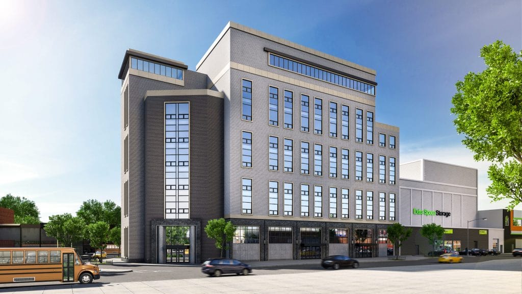 A modern multi-story building with large windows and various architectural elements stands on a sunny street. There are a few cars and a bus on the road in front. Nearby, a sign for "Extra Space Storage" is visible on another building. Trees and clear skies are in the background, adding to the charm of the surroundings.